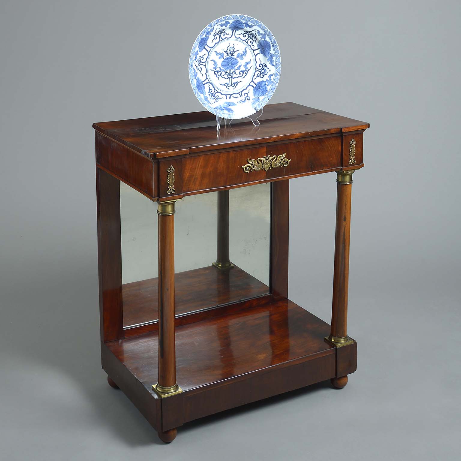 Mahogany side table with blue and white porcelain plate